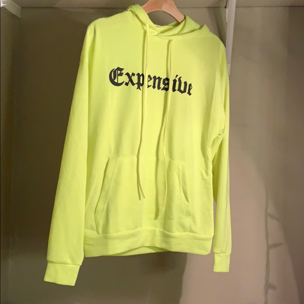 A long sleeve hoodie dress that says expensive
